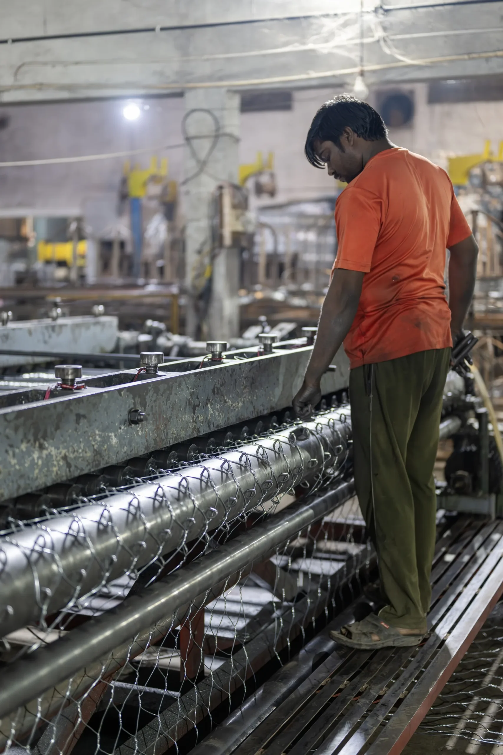 Bulk weldmesh rolls held as fabrication stock in a job shop