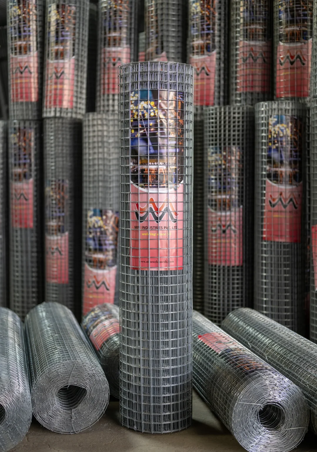 GI weldmesh rolls with galvanised finish stacked at the MM Industries yard
