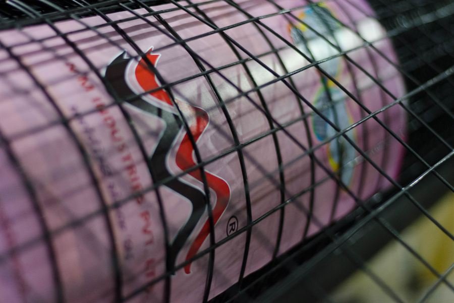 Steel rule laid across weldmesh apertures showing uniform mesh spacing